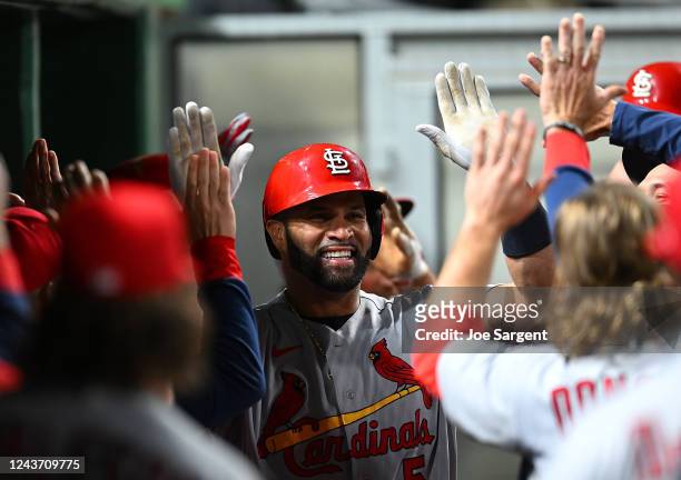 Albert Pujols of the St. Louis Cardinals celebrates his two-run home run during the sixth inning against the Pittsburgh Pirates at PNC Park on...