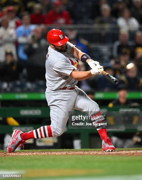 Albert Pujols of the St. Louis Cardinals hits a two-run home run during the sixth inning against the Pittsburgh Pirates at PNC Park on October 3,...
