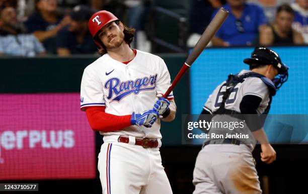 Jonah Heim of the Texas Rangers reacts after striking out against the New York Yankees during the fifth inning at Globe Life Field on October 3, 2022...
