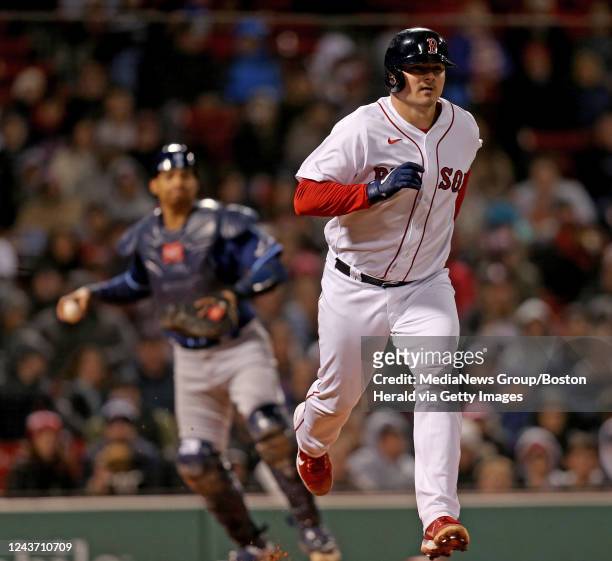 October 3: Reese McGuire of the Boston Red Sox runs to first base just before he was tagged out by Christian Bethancourt of the Tampa Bay Rays during...