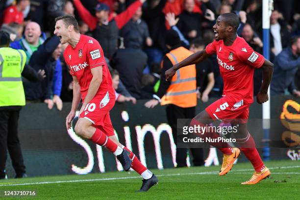 Paul Mullin of Wrexham Football Club celebrates scoring his side's second goal of the game with Aaron Hayden of Wrexham Football Club during the...