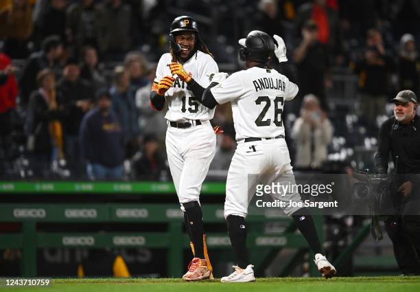 Oneil Cruz of the Pittsburgh Pirates celebrates with Miguel Andujar after Cruz's walk-off walk during the ninth inning against the St. Louis...
