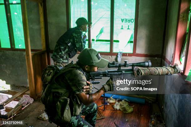 Inside the battle area, one People's Defence Forces soldier is aiming a sniper rifle while the other is observing the situation. On September 8, a...