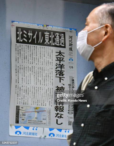 Man reads a copy of an extra edition of a newspaper in Sendai, northeastern Japan, on Oct. 4 after a ballistic missile fired by North Korea flew over...