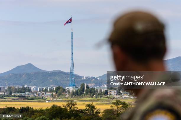 United Nations Command soldier looks at a view of North Korea near the truce village of Panmunjom inside the demilitarized zone separating the two...