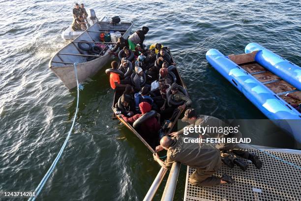 Migrants from sub-Saharan Africa are rescued by the Tunisian National Guard about 50 nautical miles in the Mediterranean sea off the coast of the...