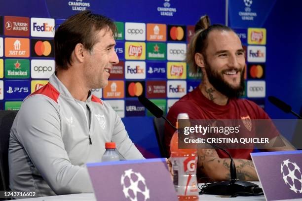 Sevilla's Spanish coach Julen Lopetegui and Sevilla's Serbian midfielder Nemanja Gudelj arrive for a press conference on the eve of their UEFA...