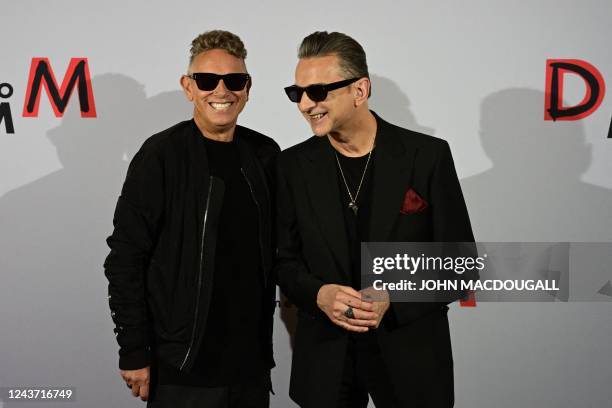 Members of the English electronic music band Depeche Mode, Martin Gore and Dave Gahan, smile ahead of a press conference in Berlin, on October 4 to...