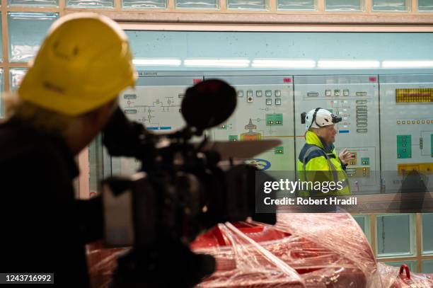 Media member records the control room at Bieudron Hydroelectric Power Station on October 3, 2022 near Heremence, Switzerland. Turbines for generating...