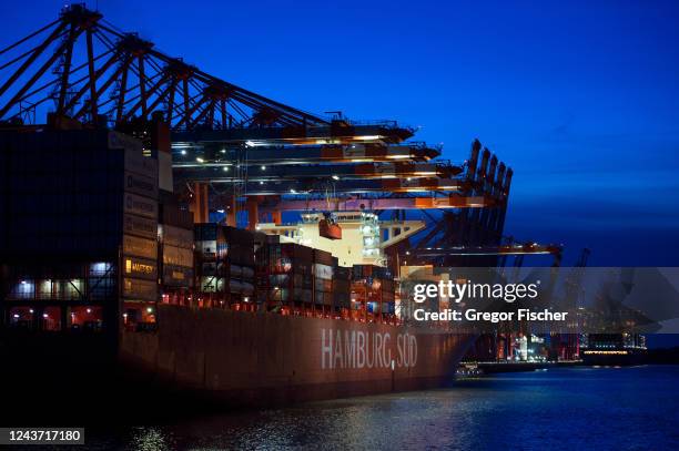 Container ship from Hamburg Sued is cleared during blue hour at Container Terminal Burchardkai at Hamburg Port on October 3, 2022 in Hamburg,...