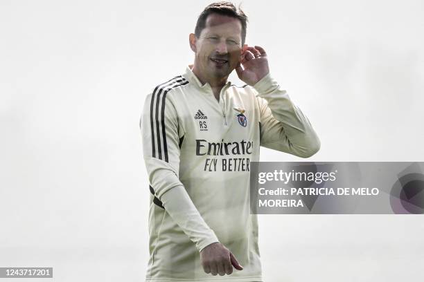 Benfica's German head coach Roger Schmidt attends a training session on the eve of their UEFA Champions League group H football against PSG, at...