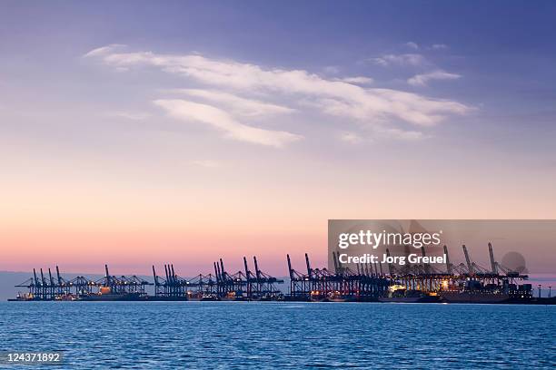 container terminal at sunset - bremen stock pictures, royalty-free photos & images