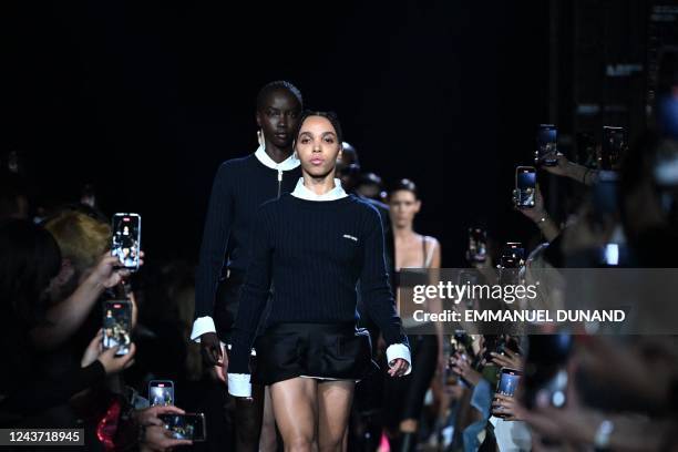 British musician Tahliah Debrett Barnett, known as FKA Twigs, presents a creation for Miu Miu during the Spring-Summer 2023 fashion show as part of...