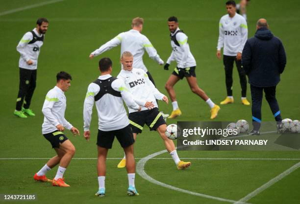 Manchester City's Norwegian striker Erling Haaland attends a training session at Manchester City training ground in Manchester on October 4 on the...