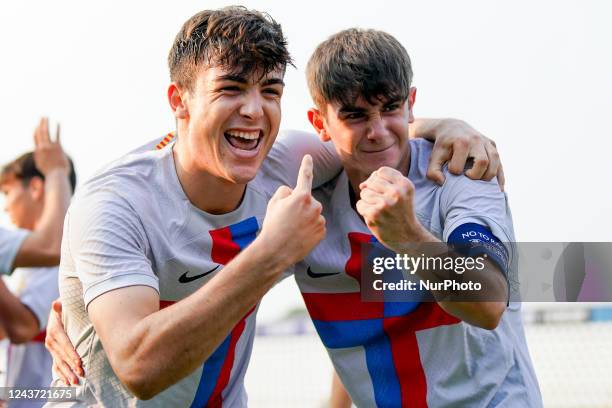 Victor Barbera of FC Barcelona celebrates with Aleix Garrido of FC Barcelona after scoring fourth goal during the UEFA Youth League match between FC...