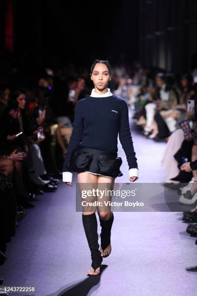 Twigs walks the runway during the Miu Miu Womenswear Spring/Summer 2023 show as part of Paris Fashion Week on October 4, 2022 in Paris, France.