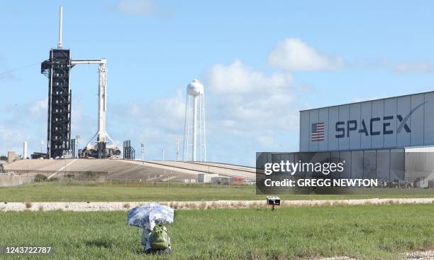 Journalist looks on near launch pad 39A on the eve of the Crew-5 mission at the Kennedy Space Center in Florida on October 4, 2022. - The rocket will...