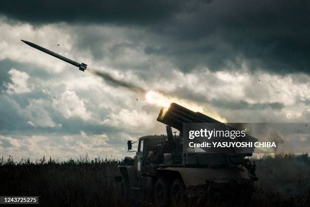 Rocket is launched from a truck-mounted multiple rocket launcher towards Russian positions in Kharkiv region on October 4 amid the Russian invasion...