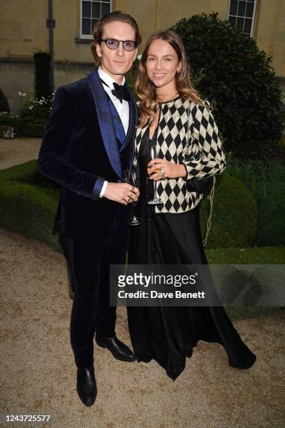 Oliver Proudlock and Emma Louise Connolly attend Joshua Kane and Lottie Archer's wedding at Syon House on October 4, 2022 in London, England.