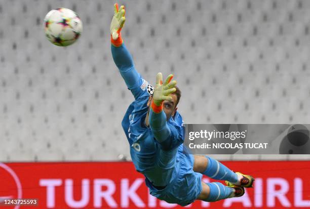 Marseille's Spanish goalkeeper Pau Lopez jumps during the UEFA Champions League group D, football match between Olympique Marseille and Sporting...