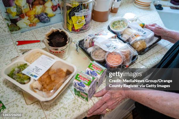 Westminster, CA A Meals on Wheels Orange County recipient shows her variety of meals after they were delivered on Thursday morning, August 18 in...