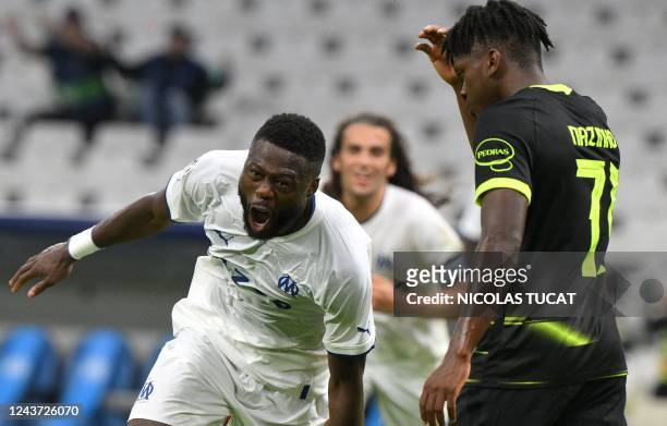 Marseille's Congolese defender Chancel Mbemba celebrates scoring his team's fourth goal during the UEFA Champions League group D, football match...