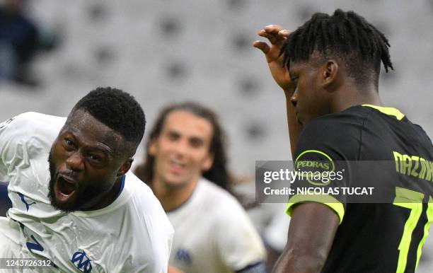 Marseille's Congolese defender Chancel Mbemba celebrates scoring his team's fourth goal during the UEFA Champions League group D, football match...