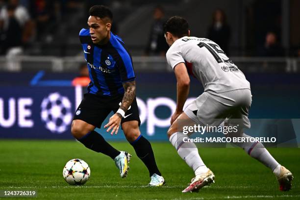 Inter Milan's Argentinian forward Lautaro Martinez challenges Barcelona's Danish defender Andreas Christensen during the UEFA Champions League Group...