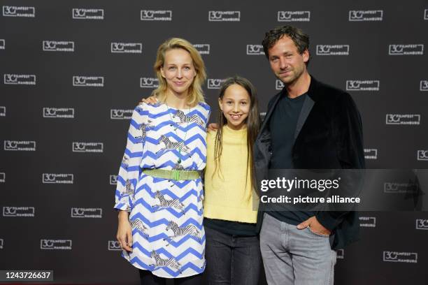 October 2022, Hamburg: Actress Petra Schmidt-Schaller , actress Tilda Wunderlich and actor Florian Stetter arrive for the photocall of the film "A...
