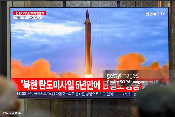 Tv screen showing a news program reporting about North Korea's missile launch with file footage, is seen at a railway station in Seoul. North Korea...
