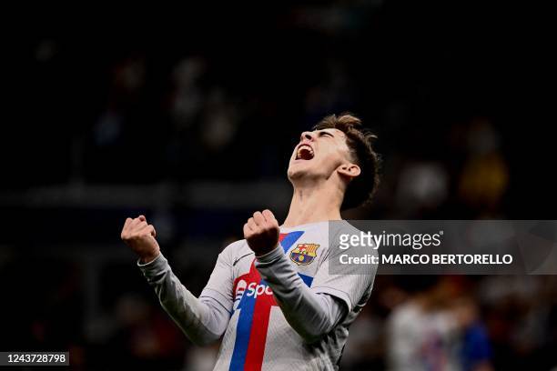 Barcelona's Spanish midfielder Gavi celebrates after scoring an equalizer during the UEFA Champions League Group C football match between Inter Milan...