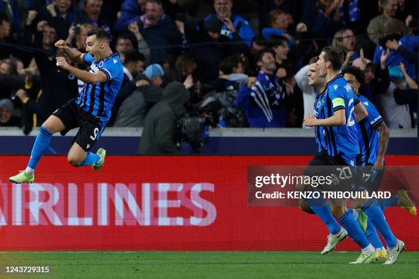 Club Brugge's Spanish forward Ferran Jutgla celebrates scoring his team's second goal during the UEFA Champions League group B football match between...