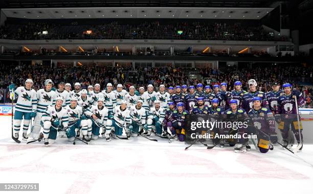 The San Jose Sharks and the Eisbaren Berlin teams pose together after they played in the NHL Global Series Challenge Germany game at Mercedes-Benz...