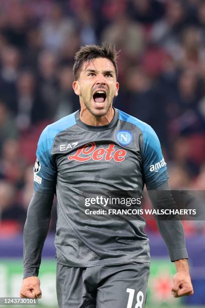 Napoli's Argentinian forward Giovanni Simeone celebrates after scoring the 1-6 goal during the UEFA Champions League group A football match between...