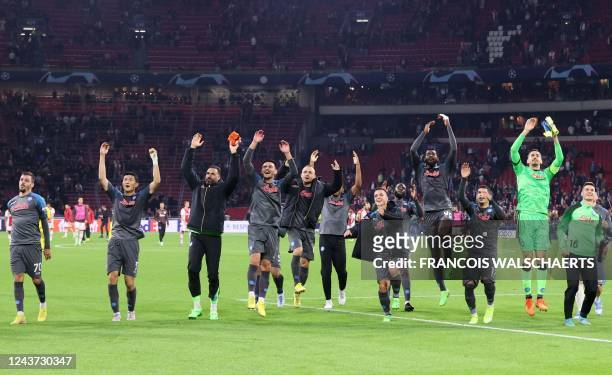 Napoli team players celebrate winning the UEFA Champions League group A football match between Ajax Amsterdam and SSC Napoli at the Johan Cruijff...