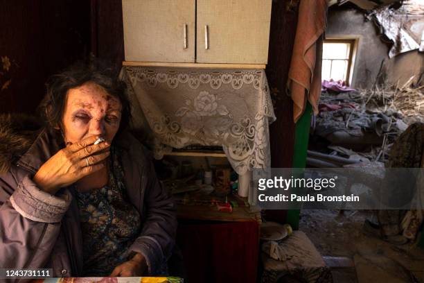 Leda Buzinna, 56 years-old, sits inside her home that was seriously damaged by shelling overnight when two S-300 missiles hit a rural neighborhood on...