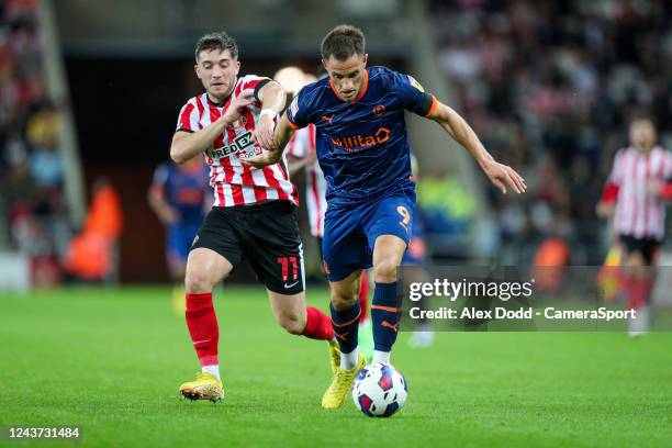 Blackpool's Jerry Yates battles with Sunderland's Lynden Gooch during the Sky Bet Championship between Sunderland and Blackpool at Stadium of Light...