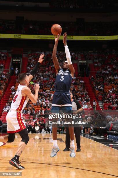 Jaden McDaniels of the Minnesota Timberwolves shoots a three point basket during the game against the Miami Heat on October 4, 2022 at FTX Arena in...