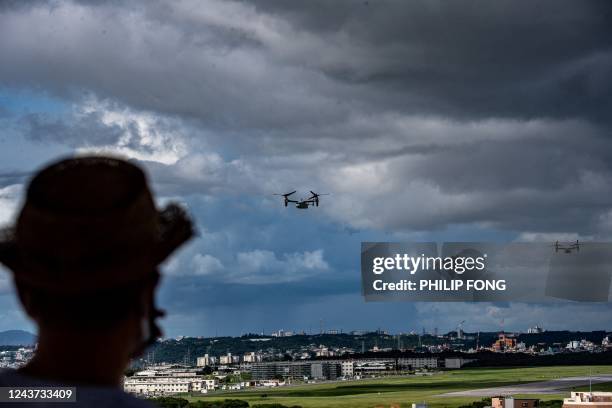 This picture taken on August 23, 2022 shows MV-22 Osprey tilt-rotor aircraft in flight after taking off from US Marine Corps Air Station Futenma, as...