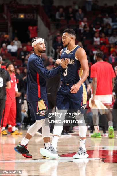 Jose Alvarado hi-fives CJ McCollum of the New Orleans Pelicans during the game against the Chicago Bulls on October 4, 2022 at United Center in...