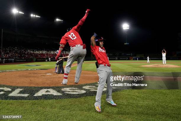 Edgar Munoz of Team Panama celebrates with Allen Cordoba after hitting a home run in the seventh inning during the game between Team Brazil and Team...