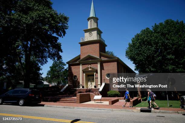 Visitors walk by First Baptist Church of Williamsburg on Sunday, August 14, 2022.
