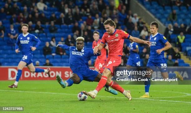 Blackburn Rovers' Sam Gallagher has a shot at goal while under pressure from Cardiff City's Cedric Kipre during the Sky Bet Championship between...