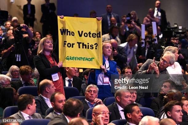 Greenpeace protesters disrupt the Prime Minister's Liz Truss keynote speech on the final day of the Conservative Party Conference on October 5, 2022...