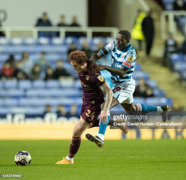 Norwich City's Josh Sargent is tackled by Reading's Tyrese Fornah during the Sky Bet Championship between Reading and Norwich City at Select Car...