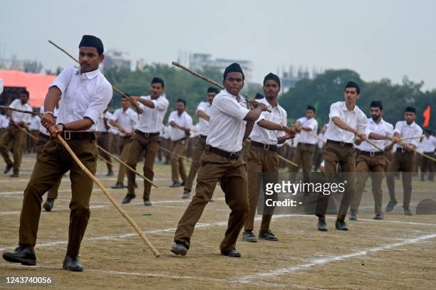 Volunteers of the Rashtriya Swayamsevak Sangh , a Hindu nationalist organisation, take part in an annual event to mark the Hindu festival of...