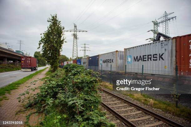 Shipping containers stand stacked on a train at Hamburg Port on October 5, 2022 in Hamburg, Germany. The German economy, and German industry in...