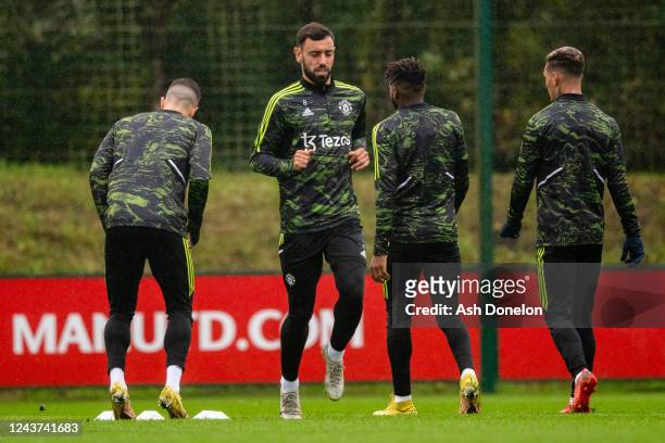 Bruno Fernandes of Manchester United in action with team-mates during a Manchester United training session at at Carrington Training Ground on...