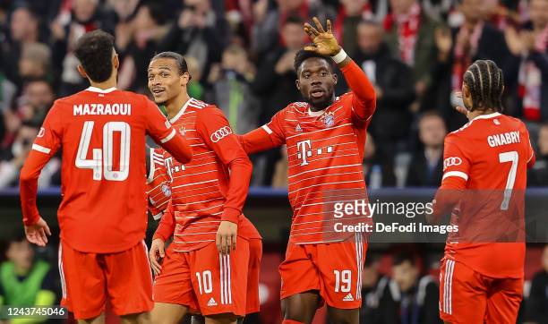 Leroy Sane of Bayern Muenchen celebrates after scoring his team's first goal with teammates during the UEFA Champions League group C match between FC...