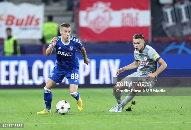 Mislav Orsic of GNK Dinamo Zagreb and Amar Dedic of RB Salzburg in action during the UEFA Champions League group E match between FC Salzburg and...